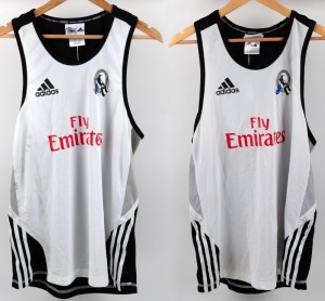 Collingwood training singlets, circa 2010-12. As previous, but with Fly Emirates to front panels and CGU to backs. Sizes XL and M. (2 items).