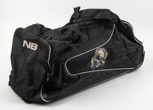 Nathan Buckley’s Collingwood coaching kit bag, circa 2015. Large black soft kit bag on wheels with ‘NB’ printed to one end; Collingwood, Star Athletics, CGU and Emirates logos along sides.