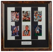 Framed group of six Nathan Buckley footy cards c1994-97 presented on a black-and-white striped background. With engraved plaque reading ‘Nathan Buckley, Collingwood Football Club.’ Origin unknown; gifted to Buckley.