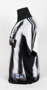 Collingwood black-and-white-striped training top/T-shirt,&nbsp;circa 2005-08. With &lsquo;Wipe Off 5 TAC&rsquo; in black bar across middle, adidas logo top right, Collingwood logo top left. - 2