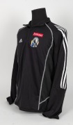 Nathan Buckley&rsquo;s Collingwood players&rsquo; jacket/track top, circa 2006. Black adidas short-zip jacket with adidas logo top right, Fly Emirates top left and Collingwood logo beneath that. Fly Emirates logo is the single line version. Rear is blank. - 2
