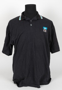 Nathan Buckley’s Allies team polo 1996-97. Black with teal/black + star logo on breast, with orange, teal and white trim.