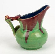 REMUED pottery jug with applied gumnut, leaf and branch handle, beautifully glazed in early lime green, pink and blue colourway, incised "Remued, 119/M", 11cm high - 2