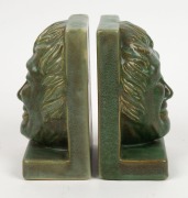 MELROSE WARE pair of green glazed face mask bookends, stamped "Melrose Ware, Australian", ​​​​​​​18cm high - 2