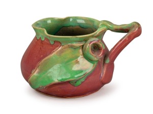 REMUED pottery jug in vibrant pink and lime green glaze with applied gumnut, leaf decoration and branch handle, incised "Remued 173SM", 7.5cm high, 13cm wide