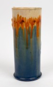 REMUED cylindrical pottery vase with applied gumnuts and leaf, glazed in blue, cream and orange, incised "Remued, 145/9M", 21cm high - 3