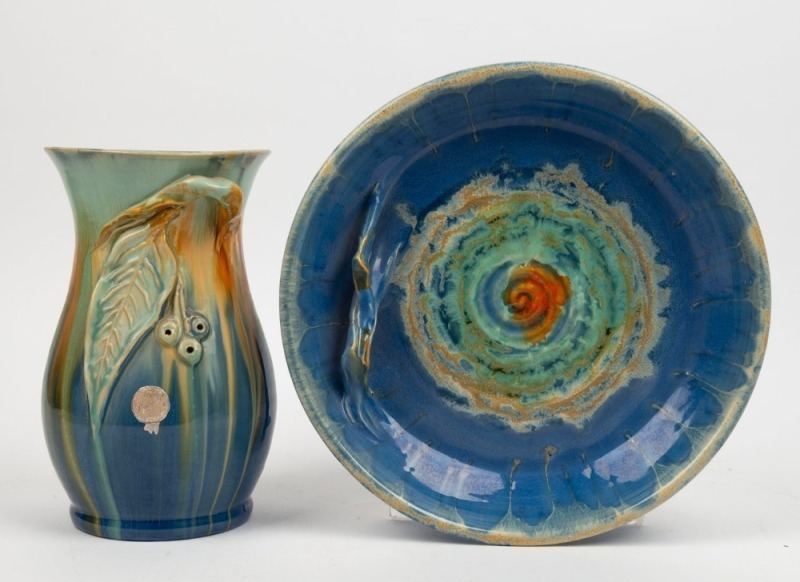 REMUED blue glazed pottery vase with applied gumnuts and leaf, together with a blue glazed fruit bowl with branch handle, (2 items), both incised "Remued", the vase 22.5cm high