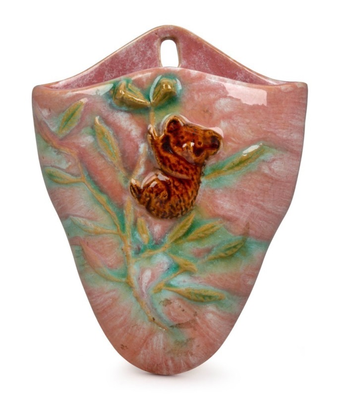 JOHN CAMPBELL rare pottery wall pocket adorned with koala, gumnuts and leaves, glazed in pink, brown and green, incised "John Campbell, Tasmania", 18cm high