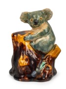 GRACE SECCOMBE&nbsp;pottery statue of a koala, moulded mark "G. S., N.S.W.", 10.5cm high