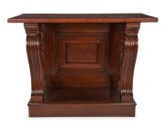 An antique Australian cedar consol table with fluted and carved scrolling supports and panelled back, 19th century, 96cm high, 127cm wide, 58cm deep