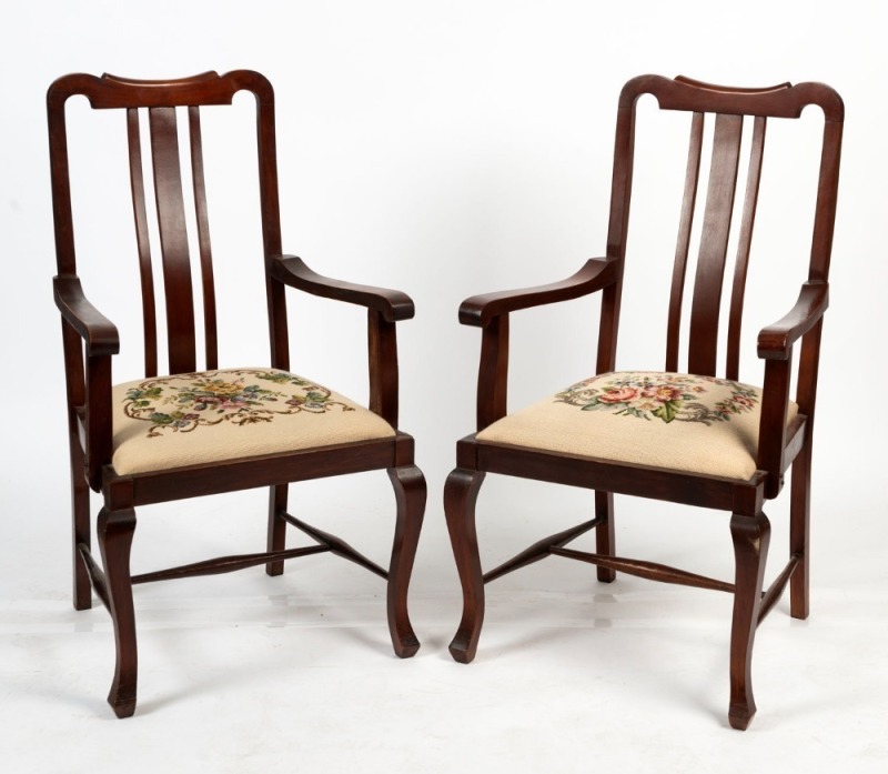 A pair of Tasmanian blackwood carver chairs with splat backs, scroll arms, cabriole style legs and floral needlework decorated drop-in seats, early 20th century, 110cm high, 63cm across the arms