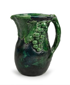 MERRIC BOYD green glazed pottery jug with applied grapes and leaves with vine handle, incised "M. Boyd, 1923", 20cm high