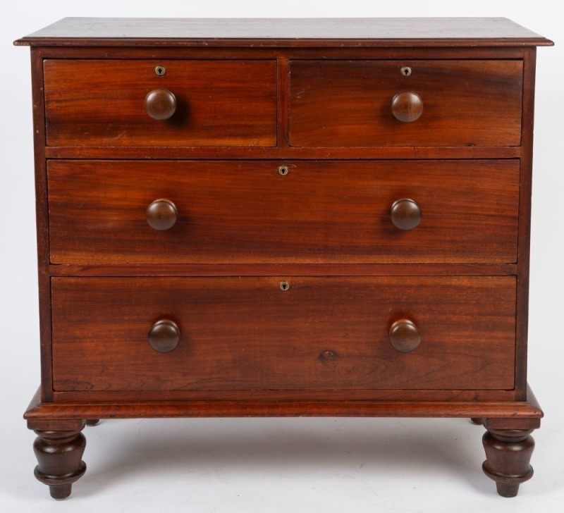 An antique Australian cedar chest of four drawers with circular brass escutcheons, New South Wales origin, circa 1855, 91cm high, 97cm wide, 43cm deep