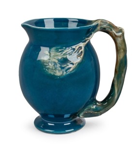 CRUFFEL Australian porcelain jug with windswept tree handle and decoration glazed in blue and green, 13cm high