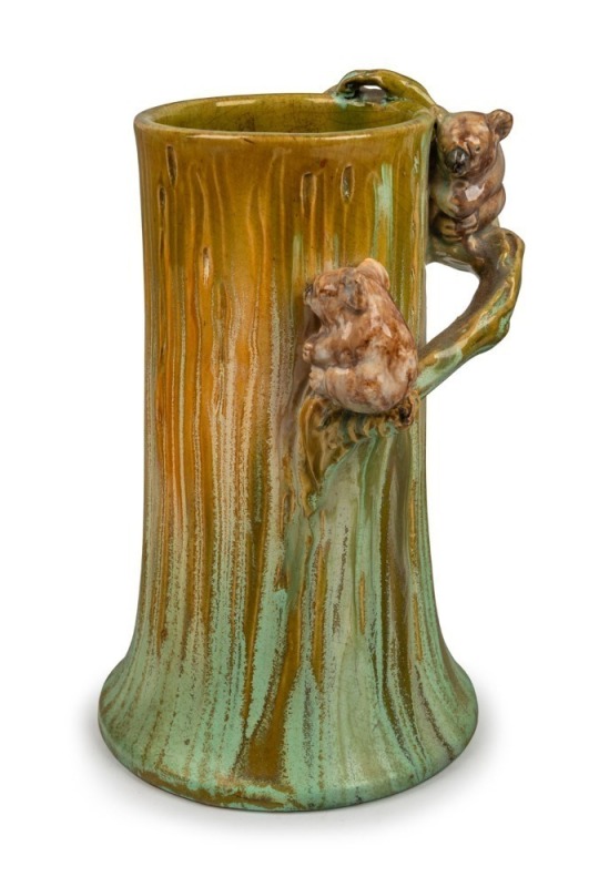 REMUED rare pottery tree stump vase adorned with two koalas on branch handle, incised "Remued, 7LB", an impressive 23.5cm high