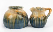REMUED&nbsp;two blue and cream glazed pottery vases with applied branch handles, the larger incised "Remued", 12cm and 13cm high
