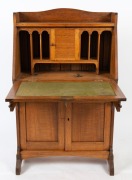 An antique Australian ash bureau with fiddleback paneled doors and bureau fall front, fitted interior with wool writing surface above a single drawer and cupboard base, circa 1920, 123cm high, 77cm wide, 40cm deep - 2