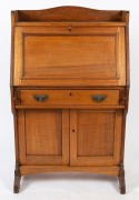 An antique Australian ash bureau with fiddleback paneled doors and bureau fall front, fitted interior with wool writing surface above a single drawer and cupboard base, circa 1920, 123cm high, 77cm wide, 40cm deep - 3