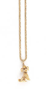 PENDANT ON CHAIN: German 9ct gold dog pendant set with diamond studded collar on rope twist chain. 34 grams.
