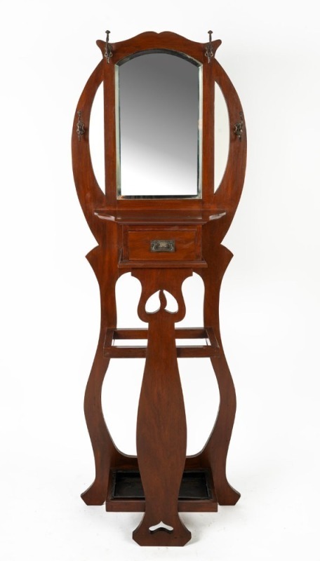 An Australian solid blackwood art nouveau style hallstand with an arch-top bevelled mirror, single drawer and pierced splat, circa 1915, ​​​​​​​187cm high, 66cm wide, 53cm deep