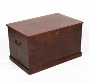 An Australian cedar flip-top trunk with dovetailed joinery, brass carry handles and a moulded plinth base, 19th century, 46cm high, 79cm wide, 50cm deep