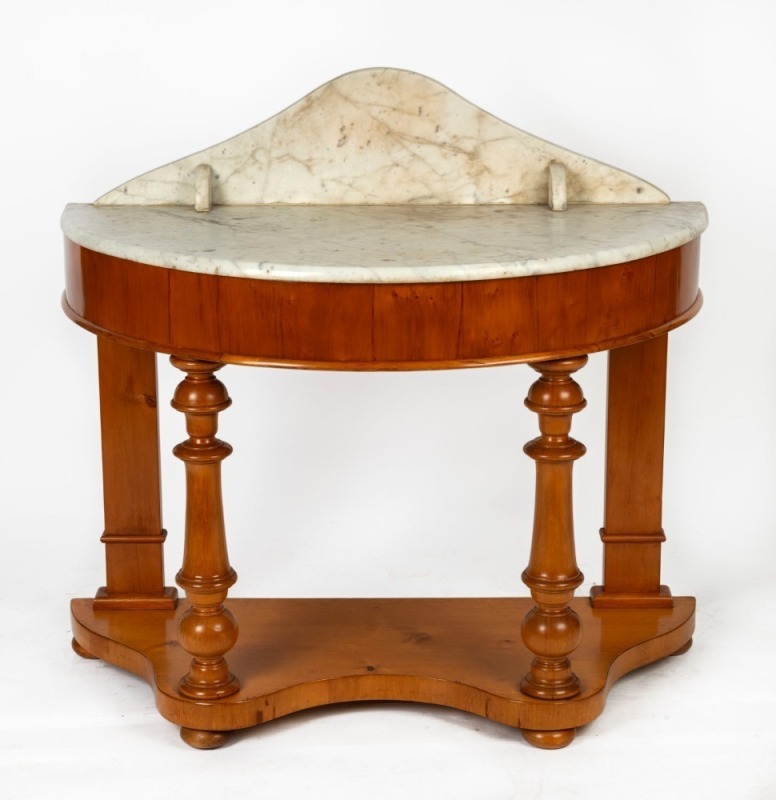 An antique Australian huon pine washstand with arch-back marble top, moulded apron, baluster legs, serpentine base and bun feet, 19th century, ​​​​​​​97.5cm high, 105cm wide, 52.5cm deep