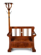 ROJO (attributed) of Melbourne, Australian Arts and Crafts solid blackwood hall seat with a hat tree, flip-top trunk and fiddleback slats, circa 1920, 192cm high, 113cm wide, 43cm deep