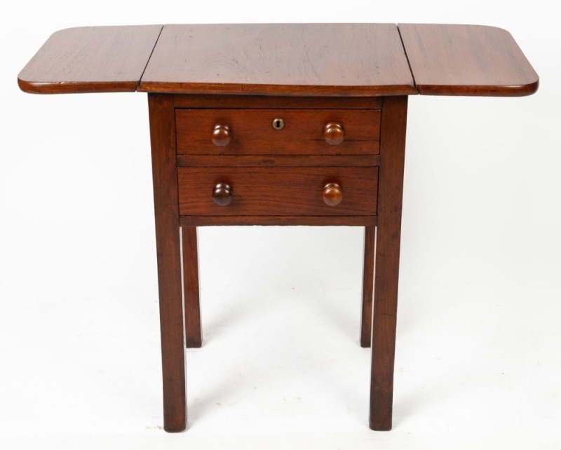 An antique Australian cedar book press worktable with drop-sides, two drawers and shaped block legs, 19th century, 74cm high, 50cm wide (91cm extended), 39cm deep