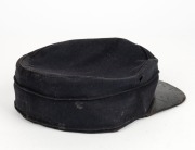 A Victoria Police kepi with Queen Victoria crown badge, 19th century. (Offered together with a card which accompanied the cap in a Lawson's auction, suggesting the cap belonged to Sergeant Kennedy, who died at Stringy Bark Creek during the Kelly Gang sieg - 2