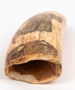 A scrimshaw whale's tooth engraved with a portrait of a young boy, 12cm high - 3