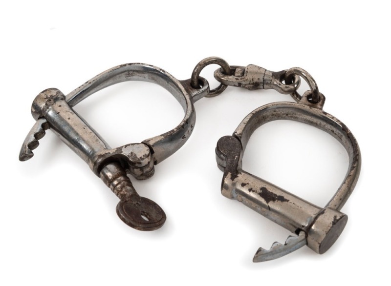 Adjustable handcuff with nickel plated finish and original key, 19th century, 27cm wide