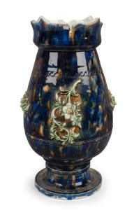 A Colonial Australian pottery urn with mottled blue and brown glaze and applied green floral decoration, 19th century, 33cm high