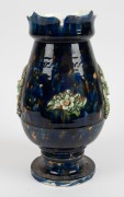 A Colonial Australian pottery urn with mottled blue and brown glaze and applied green floral decoration, 19th century, ​​​​​​​33cm high - 2