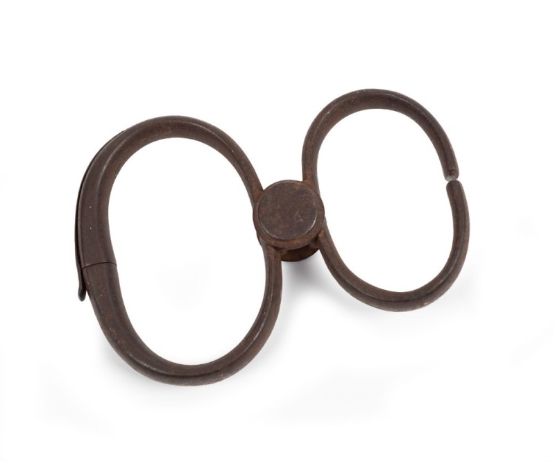 An antique pair of "Come-Along" handcuffs, 19th century