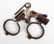 LEG IRONS with puzzle lock and key, 19th century, ​​​​​​​40cm wide - 2