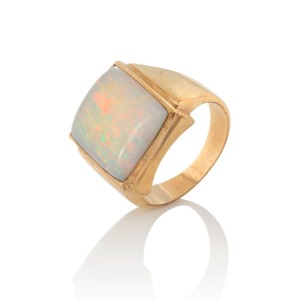 A 9ct yellow gold signet ring, set with an impressive solid white opal, 20th century, stamped "9ct", ​​​​​​​13.5 grams total