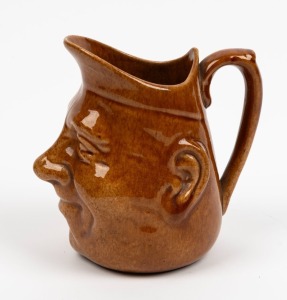 BENDIGO POTTERY brown glazed face jug, circular factory mark "Bendigo Pottery", 14cm high
