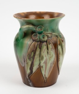 REMUED green and brown glazed pottery vase with applied gumnuts and leaves, incised "Remued, Hand Made", 19cm high