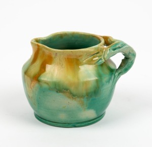 UNA DEERBON green glazed pottery jug with branch handle, incised "Una Deerbon", ​​​​​​​7.5cm high