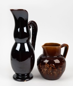 FOWLER WARE Rockingham glazed pottery jug with lyrebird feather handle, together with a hunting scene jug, (2 items), round factory marks to the bases, 40cm and 20cm high