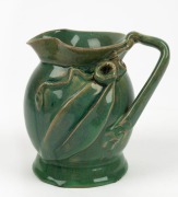 REMUED rare green glazed pottery jug with applied branch handle, gumnuts and leaf, incised "Remued, Hand Made, 166M", 14cm high