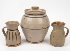 HAROLD HUGHAN studio pottery lidded jar and two milk jugs, (3 items), all signed "Hughan", the jar 22cm high