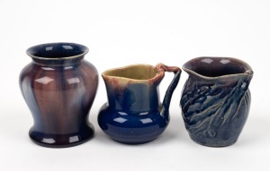 REMUED and PAMELA three blue glazed pottery vases with pink highlights, including workman's piece with unusual leaf decoration and incised markings (unsigned), branch handle example signed "Pamela, 1934" and the other incised "Remued", the largest 10cm high
