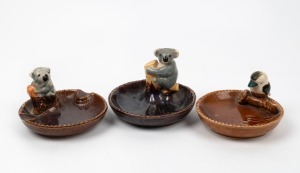 Three Australiana ceramic ashtrays with koalas and kookaburra, the largest 10cm wide