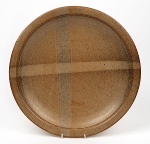 ADRIAN McMILLAN brown glazed pottery charger, signed 'A. McMillan 1984, 43cm diameter