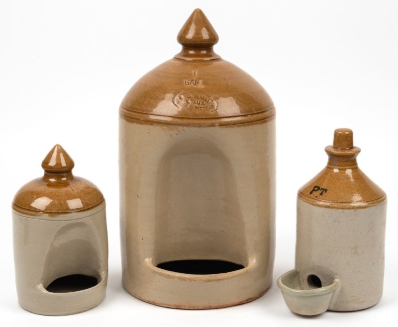 Three assorted pottery bird feeders, two examples stamped "W. C. Bennett, Magill Pottery", 32cm high