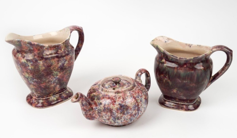 BENDIGO POTTERY "Waverley Ware" tea pot and two jugs with pink spongeware finish, (3 items), the largest 17cm high