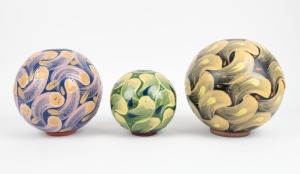 RAY TAYLOR group of three spherical Australian pottery vases with hand-painted finish, each signed "R. T.", ​​​​​​​the largest 21cm high