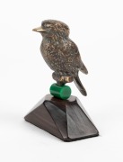 A cast bronze kookaburra statue on a later green bakelite and rosewood base, early 20th century, ​​​​​​​13cm high