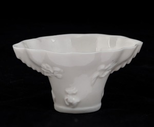 A Chinese blanc de chine libation cup, 19th/20th century, ​5cm high, 10cm wide